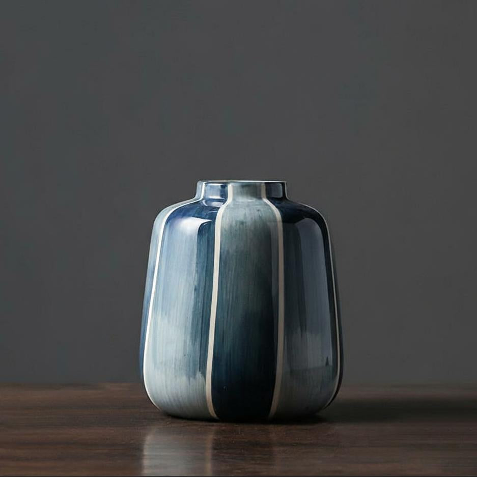 Detail of short blue glazed ceramic vase