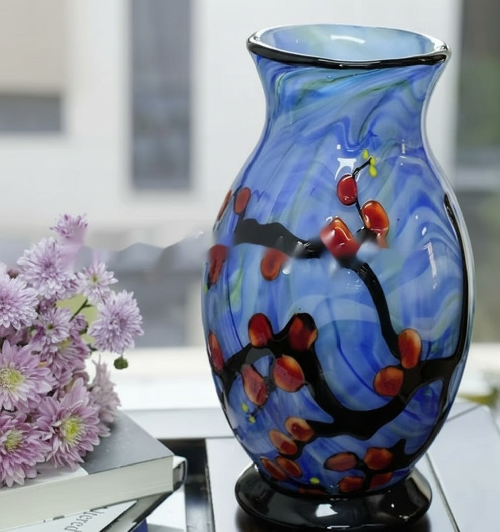 Side profile of the blue art glass vase highlighting the black base