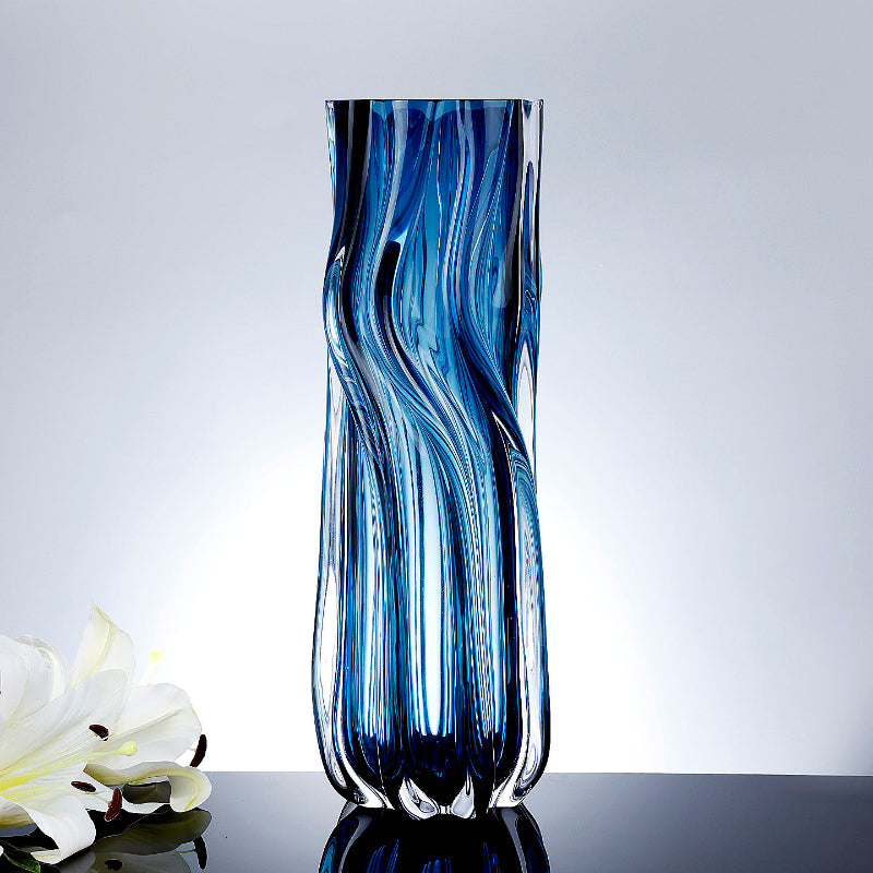 Front view of deep blue swirled glass twisted cylinder vase