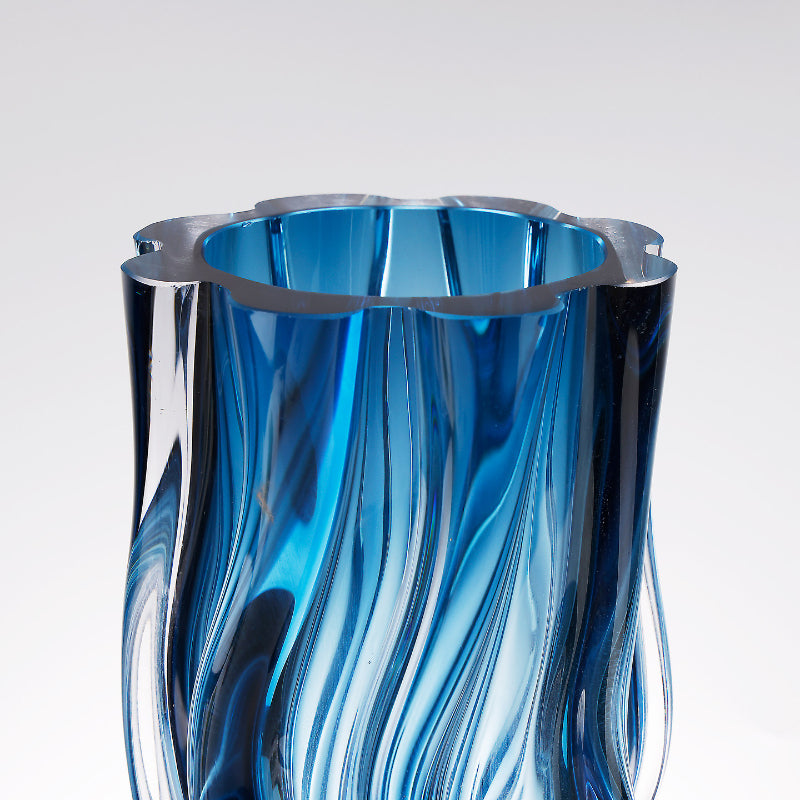 Detail shot of scalloped rim and blue glass texture