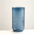 Large blue textured glass cylindrical vase front view