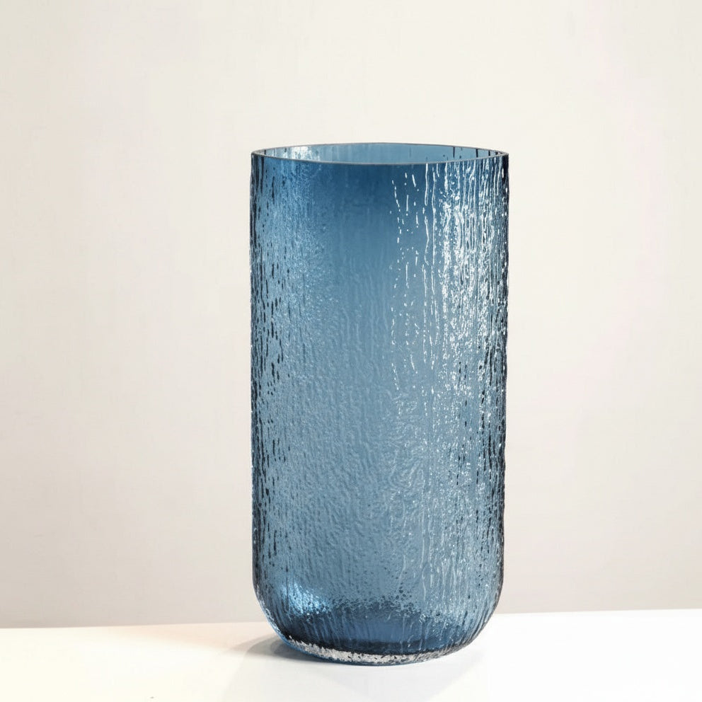 Large blue textured glass cylindrical vase front view