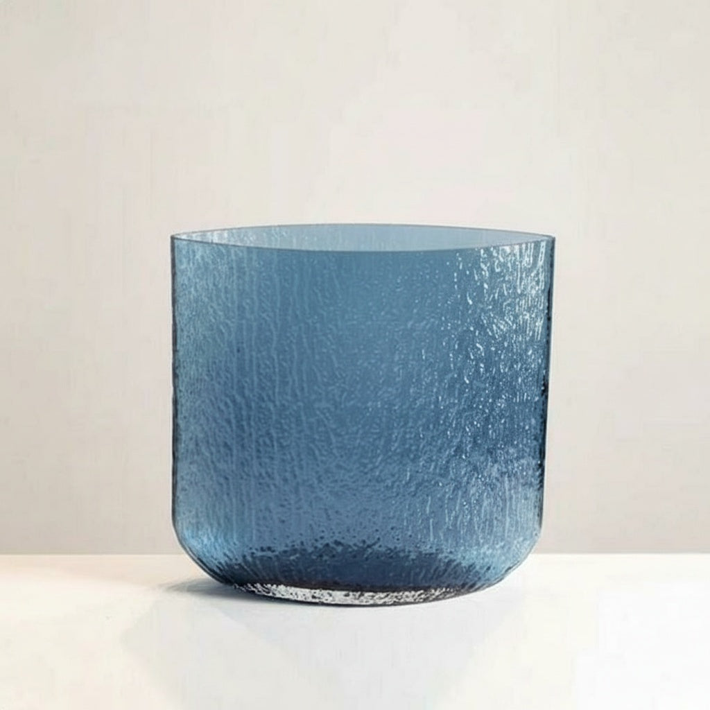 Medium blue textured glass cylindrical vase front view