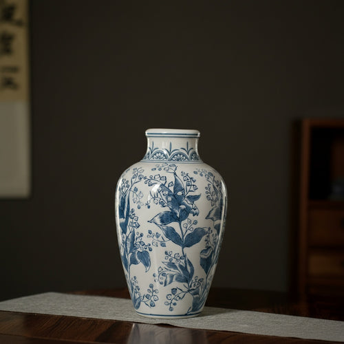 Close up of blue and white ceramic vase botanical details