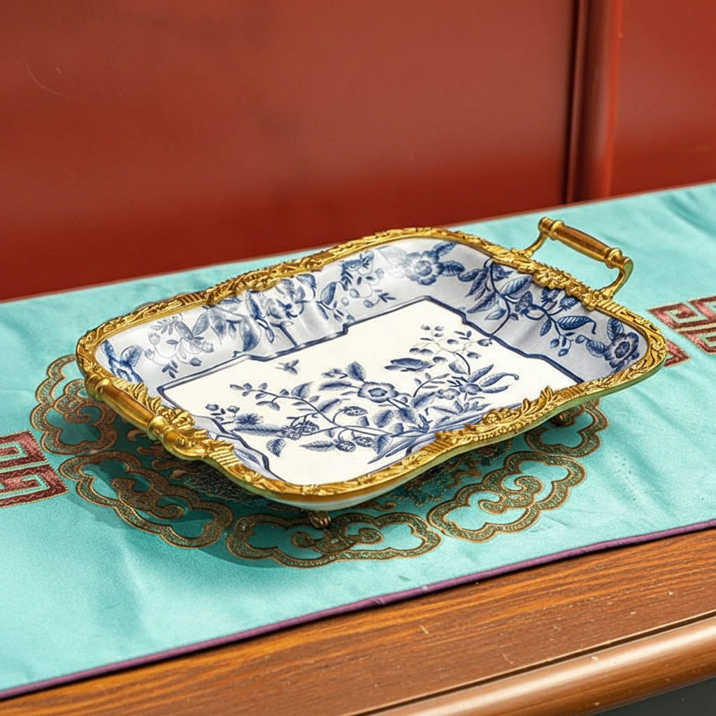 Full view of blue and white ceramic tray with gold copper rim