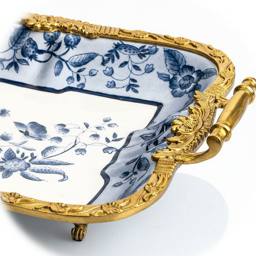 Close up detail of ornate copper handle and floral ceramic pattern