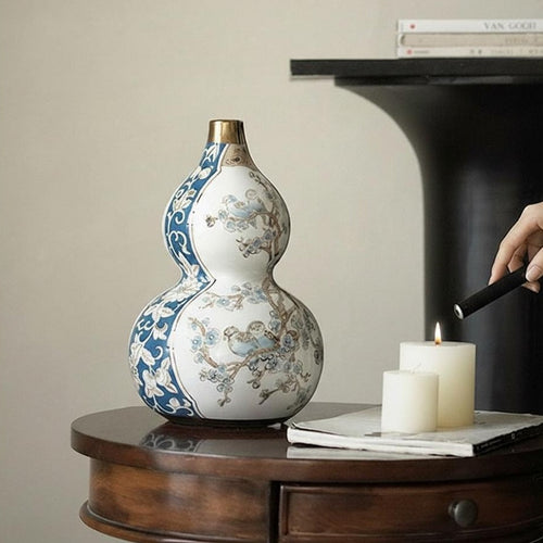 Blue and white ceramic double gourd vase on wooden table