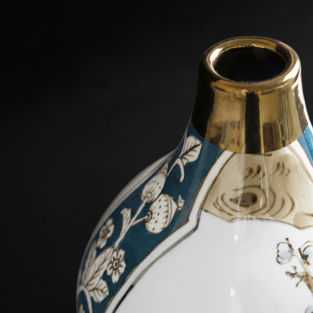 Detail shot of gold rim on blue and white vase