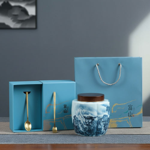 Blue and white ceramic fluted tea caddy with matching gift box and golden spoon