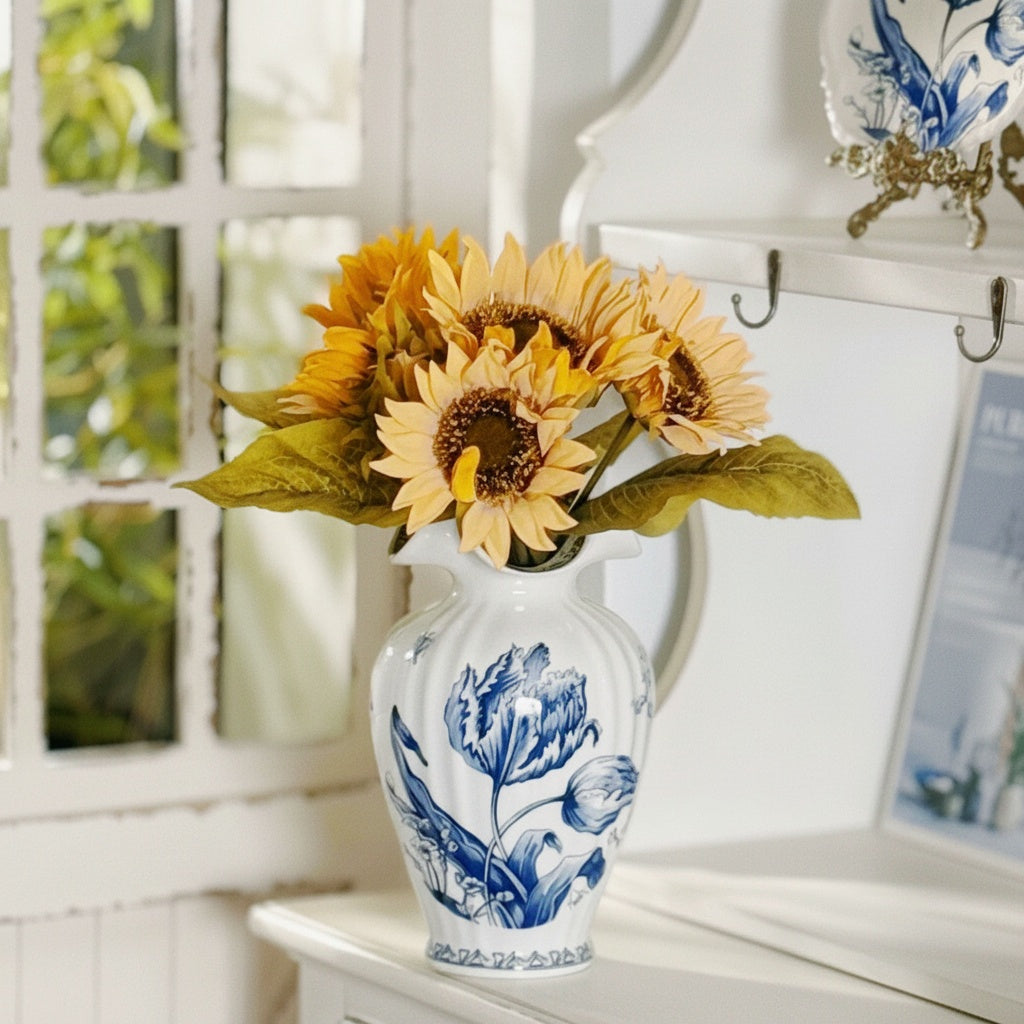 Blue and white ceramic fluted vase with floral design