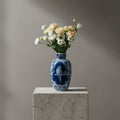 Lifestyle shot of ceramic vase with fresh flowers in living room