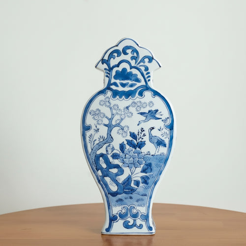 Blue and white ceramic profile vase with crane motif