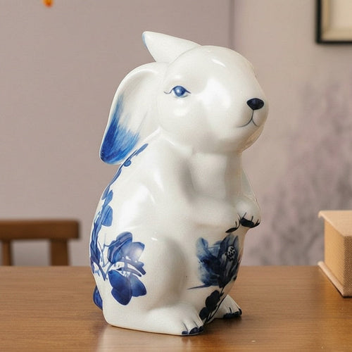 Standing ceramic rabbit statue with blue floral details