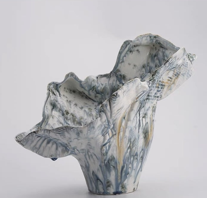 Front view of abstract blue and white glazed ceramic sculptural vase