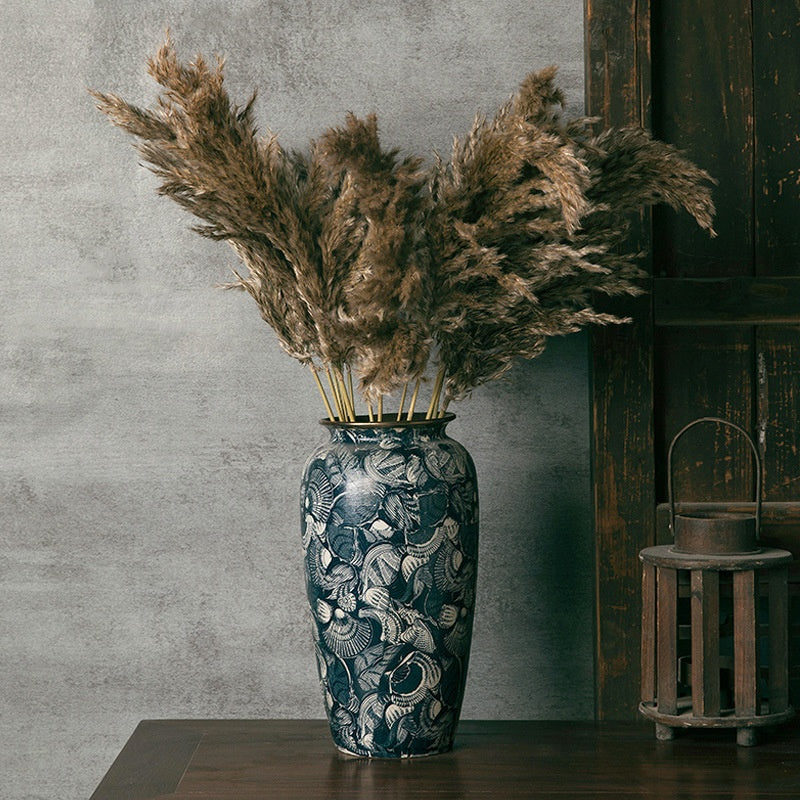 Large blue and white ceramic vase with dried pampas grass