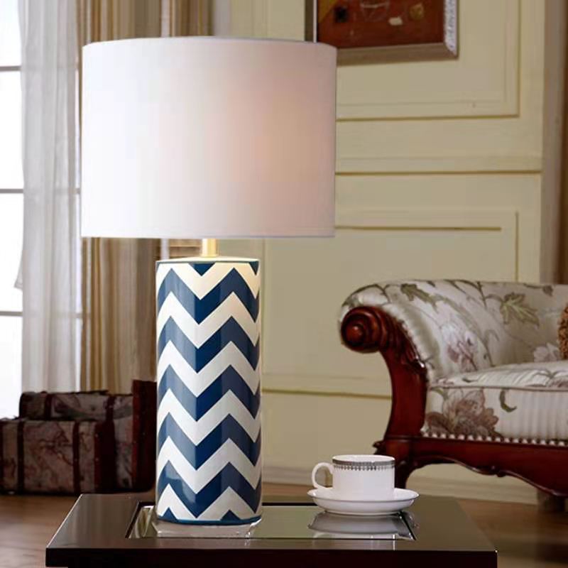Illuminated blue and white geometric lamp in cozy lounge interior