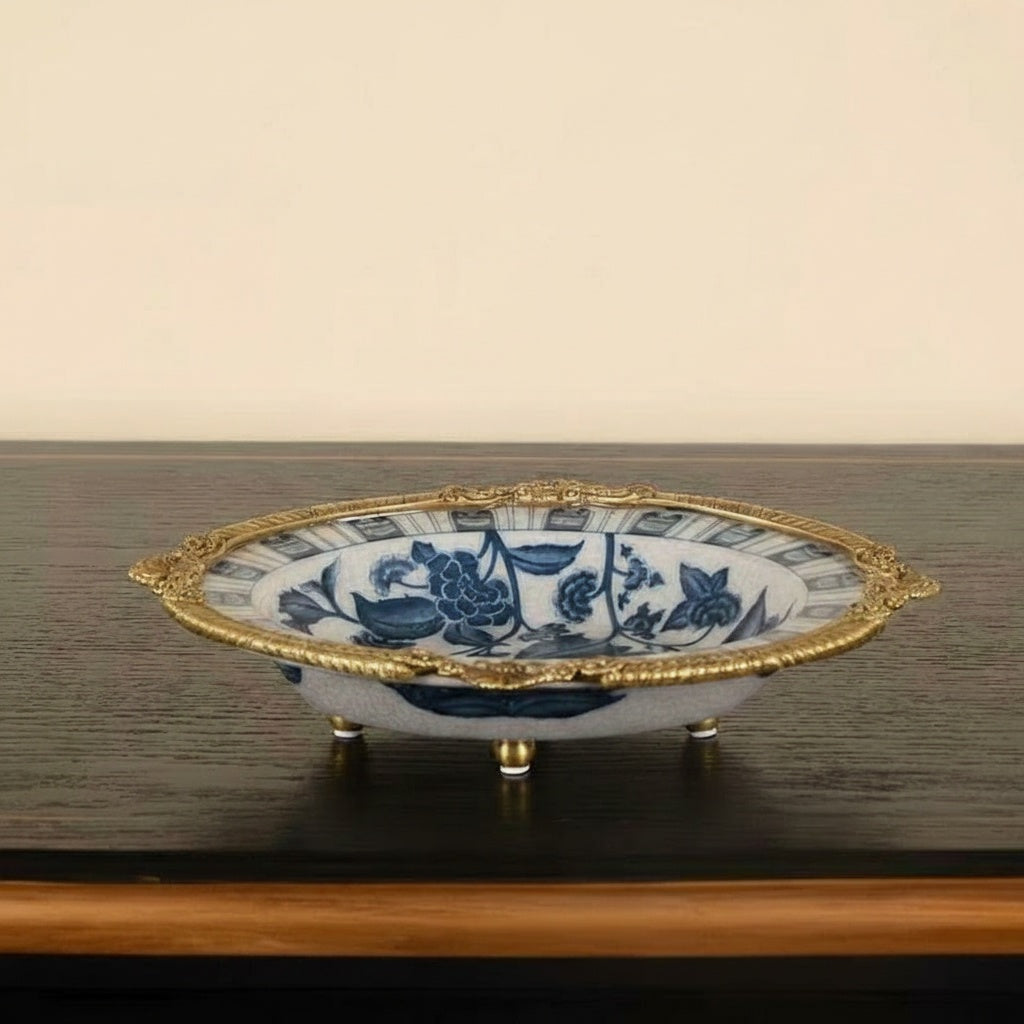 Side profile of decorative bowl showing brass rim and feet details