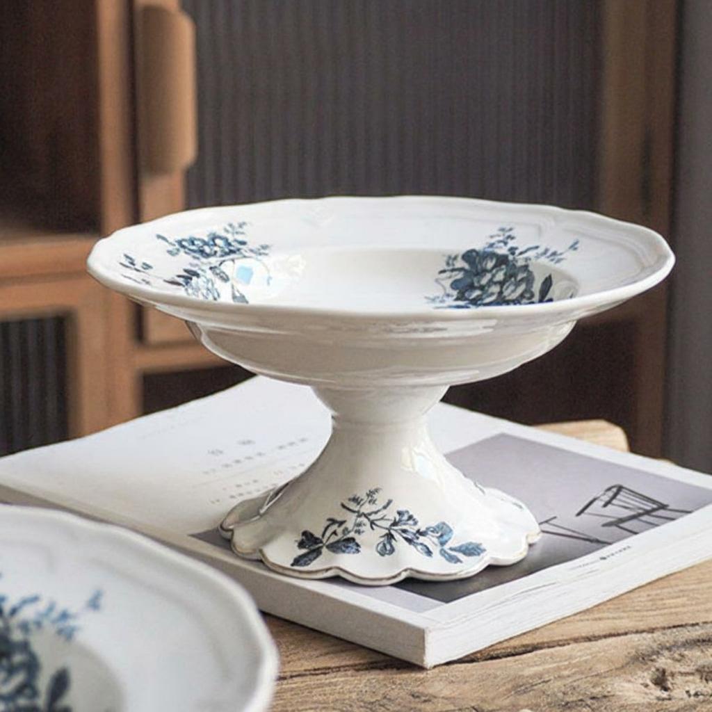Front view of blue and white floral ceramic pedestal bowl