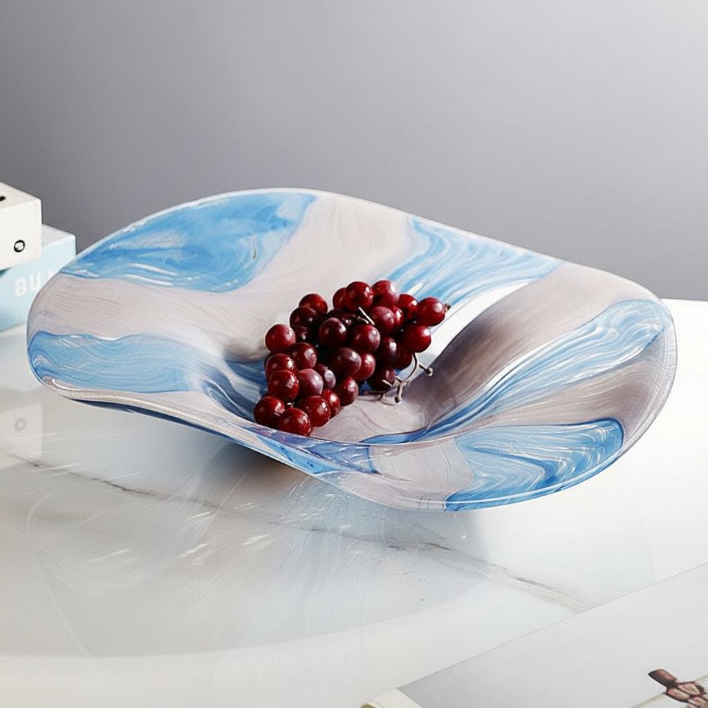 Blue white marbled glass centerpiece bowl styled with fruit on modern table setting