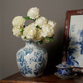 Blue and white porcelain vase styled with white flowers