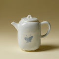 Blue and white porcelain teapot with butterfly motif