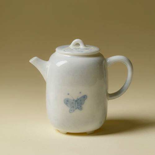 Blue and white porcelain teapot with butterfly motif