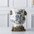 Front view of blue and white porcelain vase with gold accents