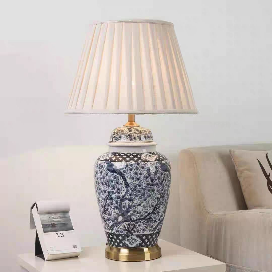 Detailed view of blue and white ceramic bird motif on lamp body