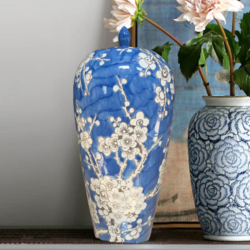 Close up of blue porcelain vase with white floral details
