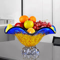 Blue and yellow crystal fruit bowl with fruit