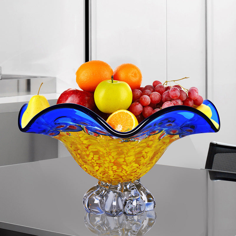 Blue and yellow crystal fruit bowl with fruit