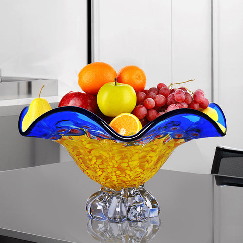 Blue and yellow crystal fruit bowl with fruit