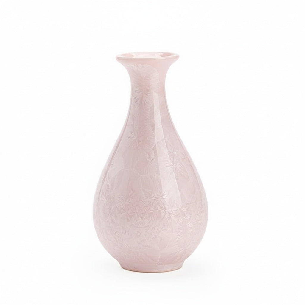 Blush patterned ceramic bud vase on a white background
