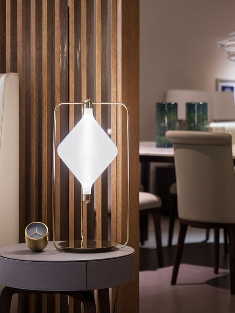 Illuminated diamond table lamp on bedside table