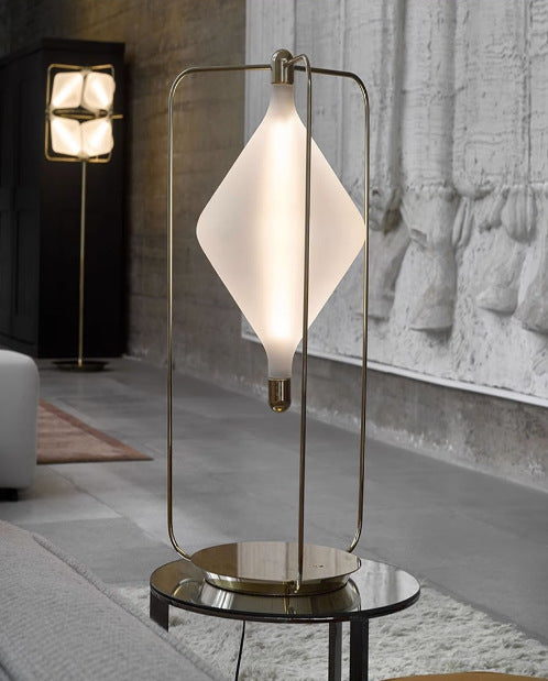 Full view of suspended diamond shade lamp in industrial interior