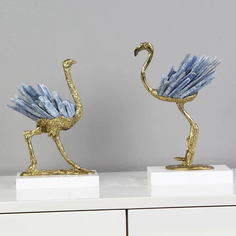 Side angle view of luxury bird sculptures on marble base