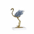 Side view of the standing flamingo style brass sculpture