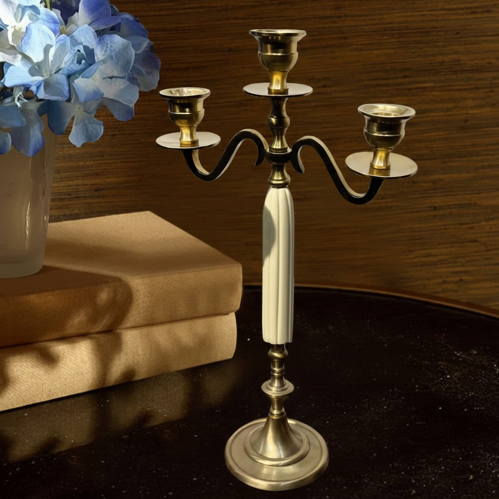 Brass and cream fluted candelabra with flowers