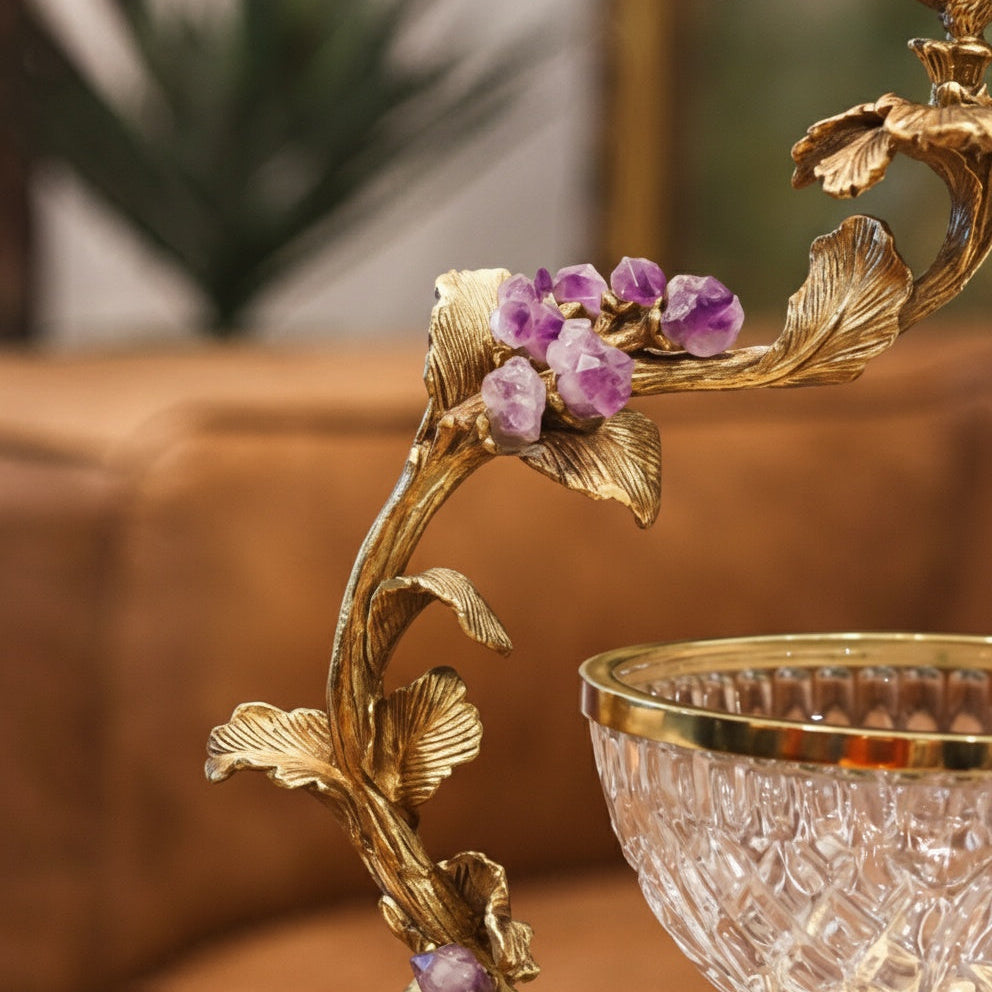 Close up of crystal bowl rim and brass leaves
