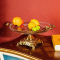 Brass and crystal fruit stand with fresh fruit display