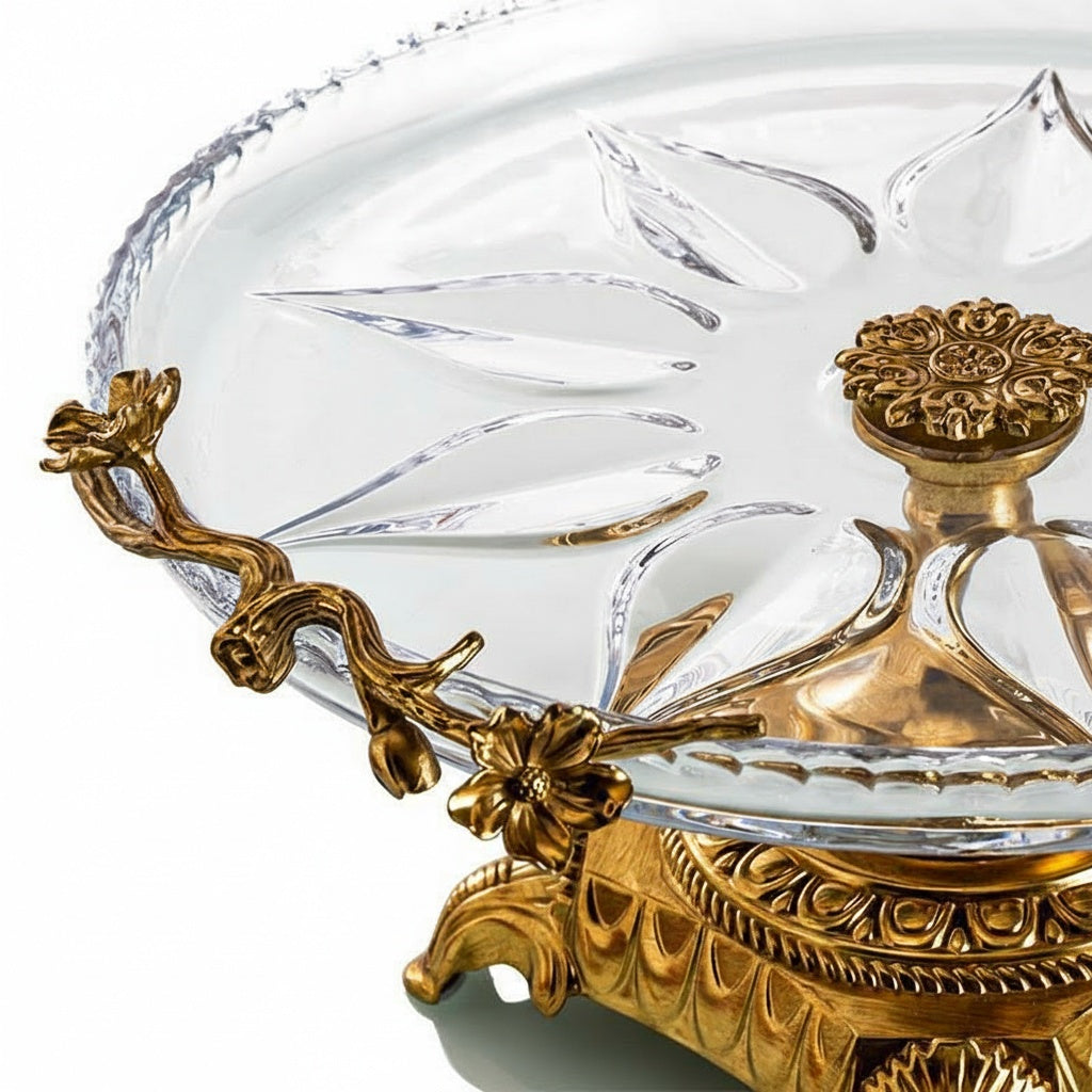 Detail of brass floral handle and crystal platter texture