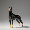Front angle view of black and gold brass Doberman statue