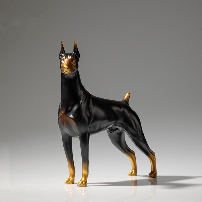 Front angle view of black and gold brass Doberman statue