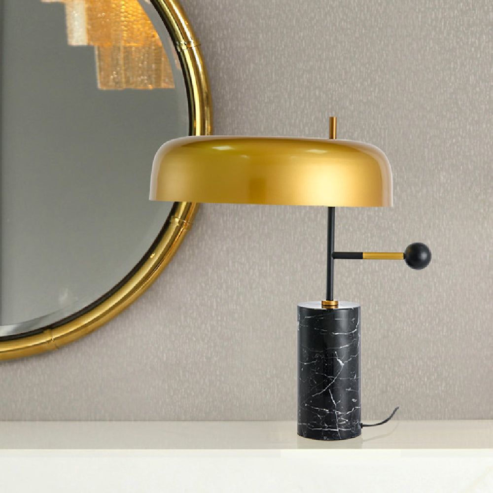 Front view of brass and marble table lamp unlit