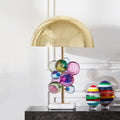 Front view of brass dome table lamp with colorful glass bubbles