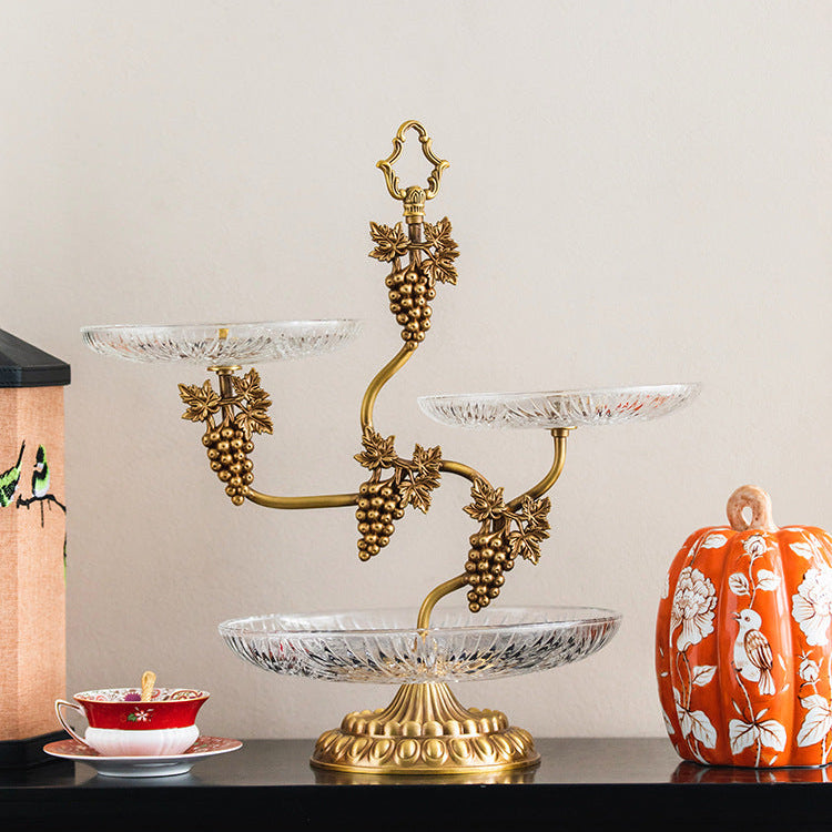 Full view of empty brass serving stand showing glass texture