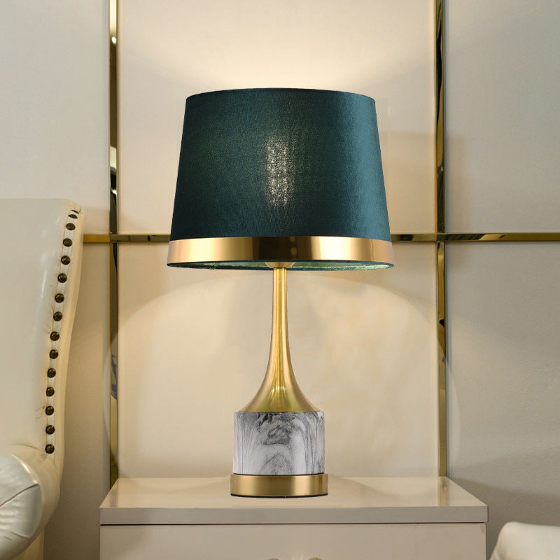Illuminated brass and marble table lamp with green velvet shade