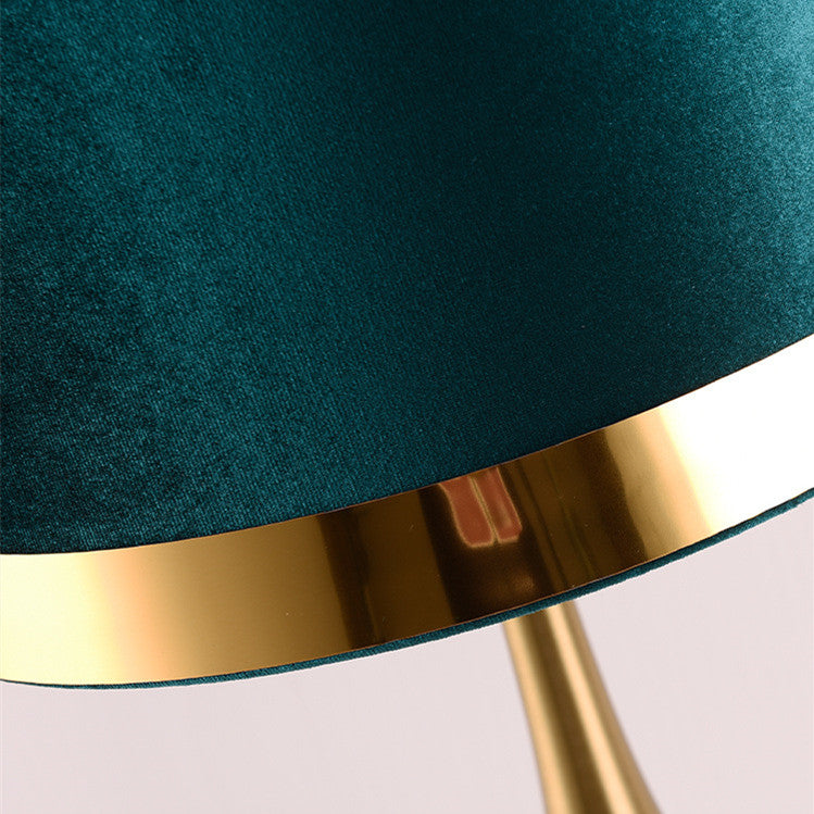 Detail of gold trim on green velvet lampshade
