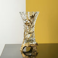 Brass and textured glass vase with floral vine details front view