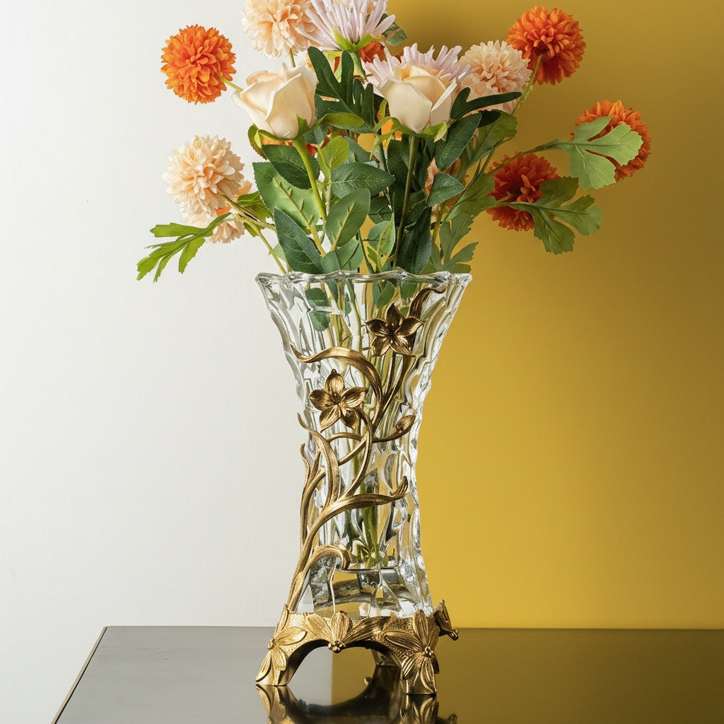 Brass and textured glass vase holding flowers angled view